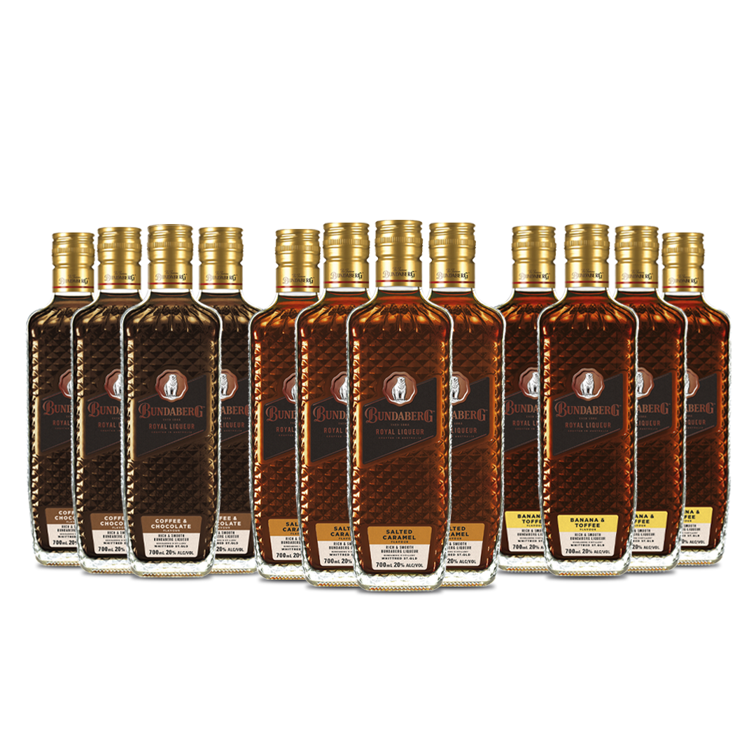 Row of seven rectangular amber liquor bottles standing in a line on a white background; labels show circular logos and printed text, but the text is not legible.