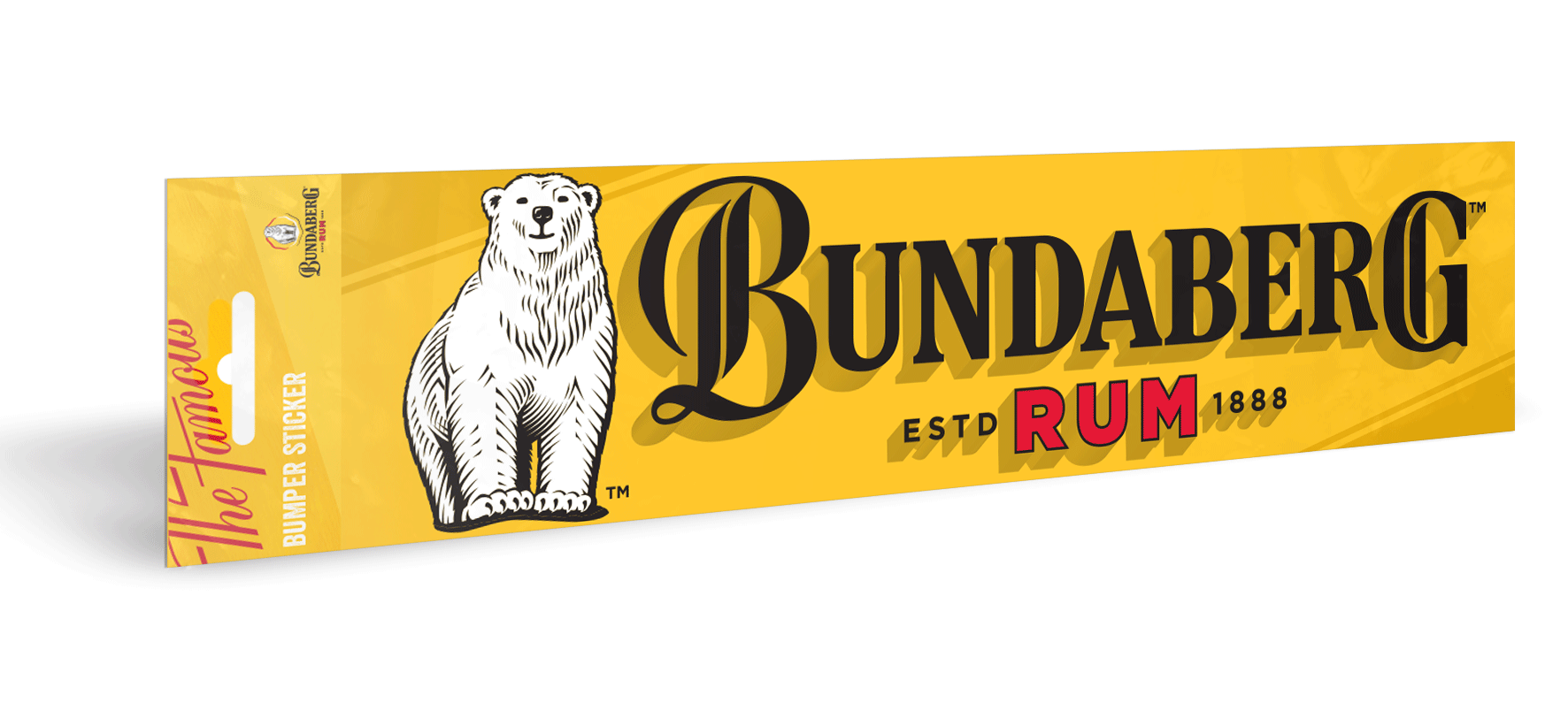 Yellow Bundaberg Rum carton displays a polar-bear logo, angled and resting on a white surface with a soft shadow. Text: "BUNDABERG RUM"