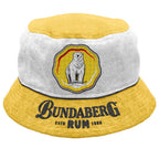 Yellow-and-white bucket hat displays a circular patch featuring a standing polar bear and the "Bundaberg Rum" logo on its brim; photographed against a plain white background.