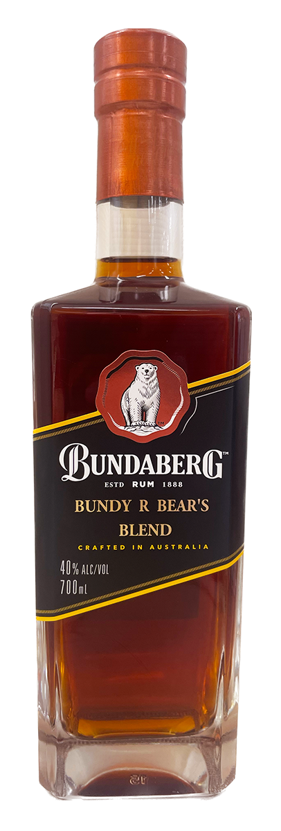 Tall clear glass bottle of dark amber rum standing upright against a plain white background.