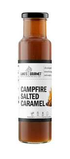 A tall glass bottle stands upright on a white background, filled with brown sauce; label shows a small flame illustration.