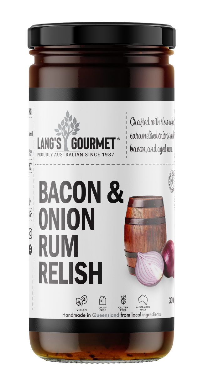 A glass jar of relish labeled and centered; it displays a product name and logo on a white label with a wooden barrel and sliced red onion illustration on a plain white background.