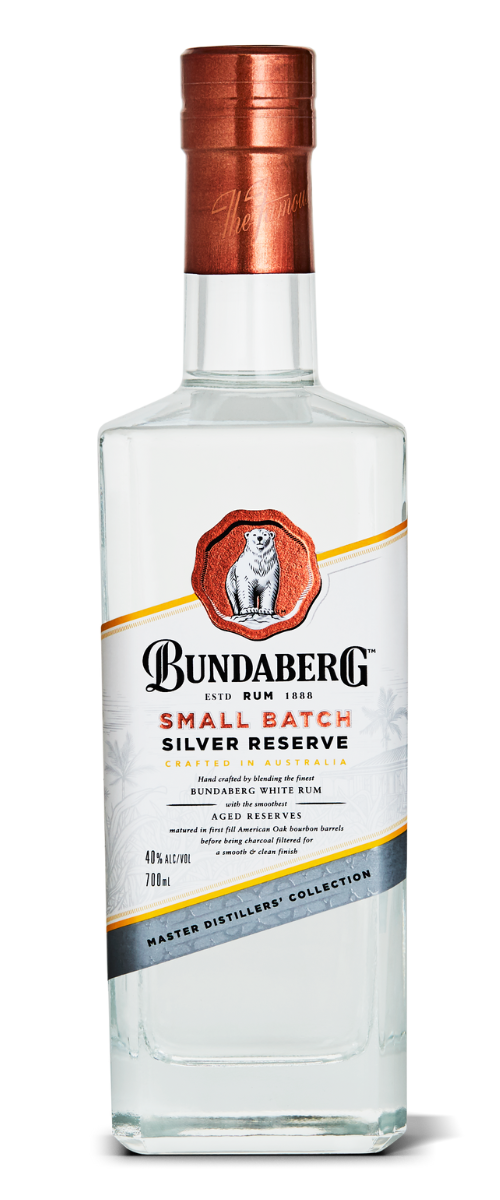 Clear glass Bundaberg bottle standing upright, capped with copper foil; label reads "BUNDABERG SMALL BATCH SILVER RESERVE," photographed isolated on a plain white background.