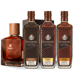 Four liquor bottles stand upright side-by-side on a plain background: three tall Bundaberg rum liqueur bottles and one shorter square bottle labeled "Solera."