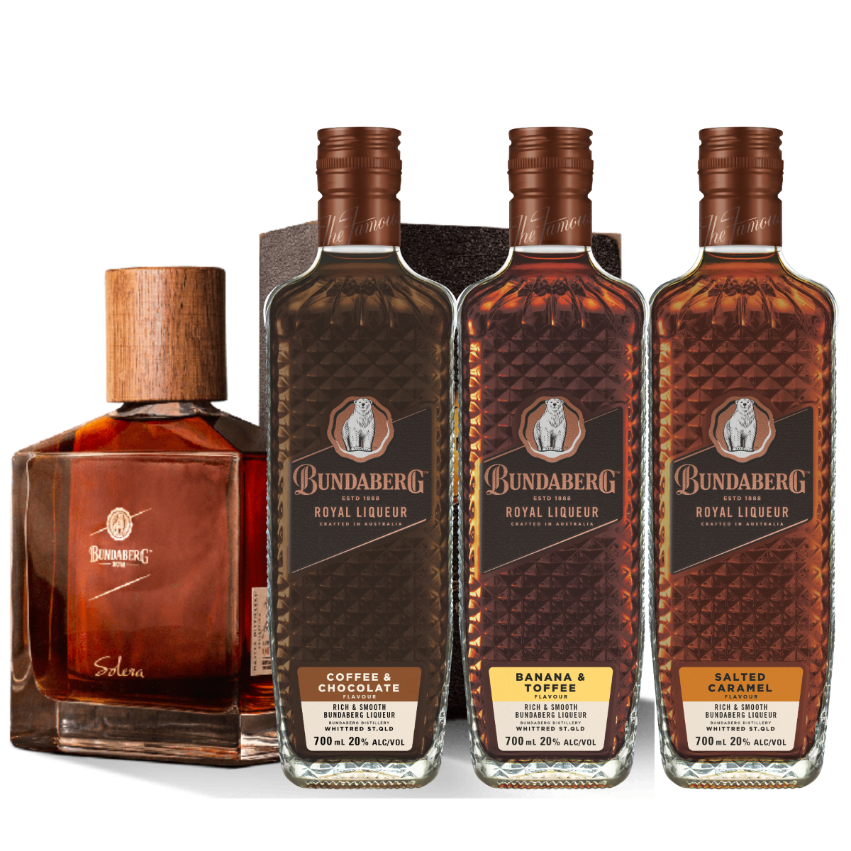 Four liquor bottles stand upright side-by-side on a plain background: three tall Bundaberg rum liqueur bottles and one shorter square bottle labeled "Solera."